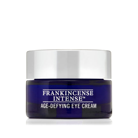 Neals Yard Remedies Frankincense Intense Age Defying Eye Cream in a blue jar. It is a product shot with a white background
