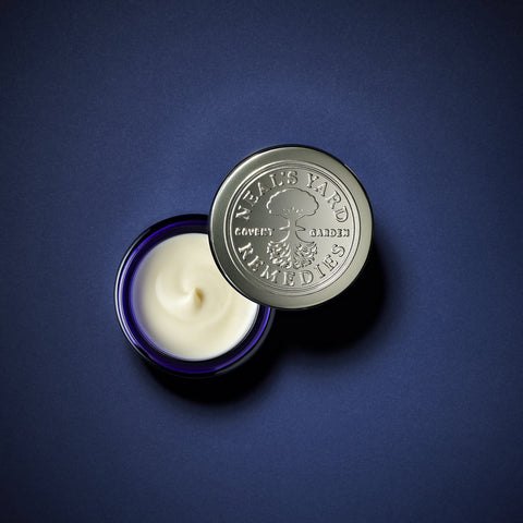 Neal's Yard Remedies Frankincense Intense Age-Defying Eye Cream 15 blue bottle top view product photo on a blue canvas