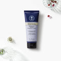 Neal's Yard Remedies' Rehydrating Rose Facial Polish tube on a beautiful white canvas. 