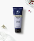 Neal's Yard Remedies' Rehydrating Rose Facial Polish tube on a beautiful white canvas. 