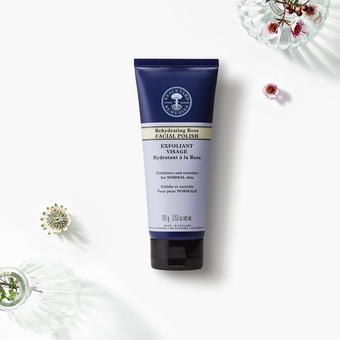 Neal's Yard Remedies' Rehydrating Rose Facial Polish tube on a beautiful white canvas. 