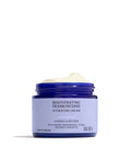 Jar of rejuvenating frankincense hydrating cream on a white background