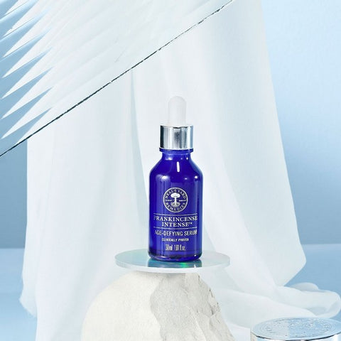 Frankincense Intense Age-Defying Serum with nice white blue background