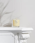 Organic Aromatherapy Candle - Uplifting candle on white ledge