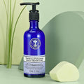 Purifying Palmarosa Daily Moisture bottle in green spa background